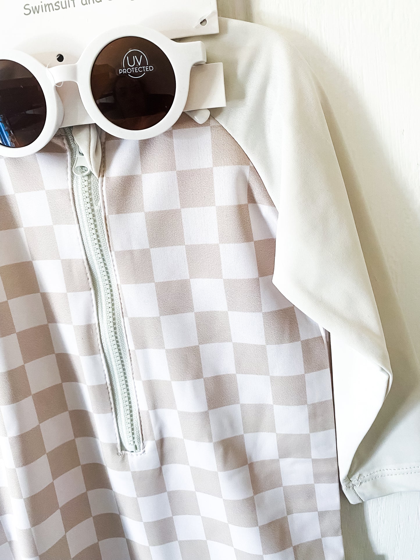 Checkered swimsuit with white sunglasses