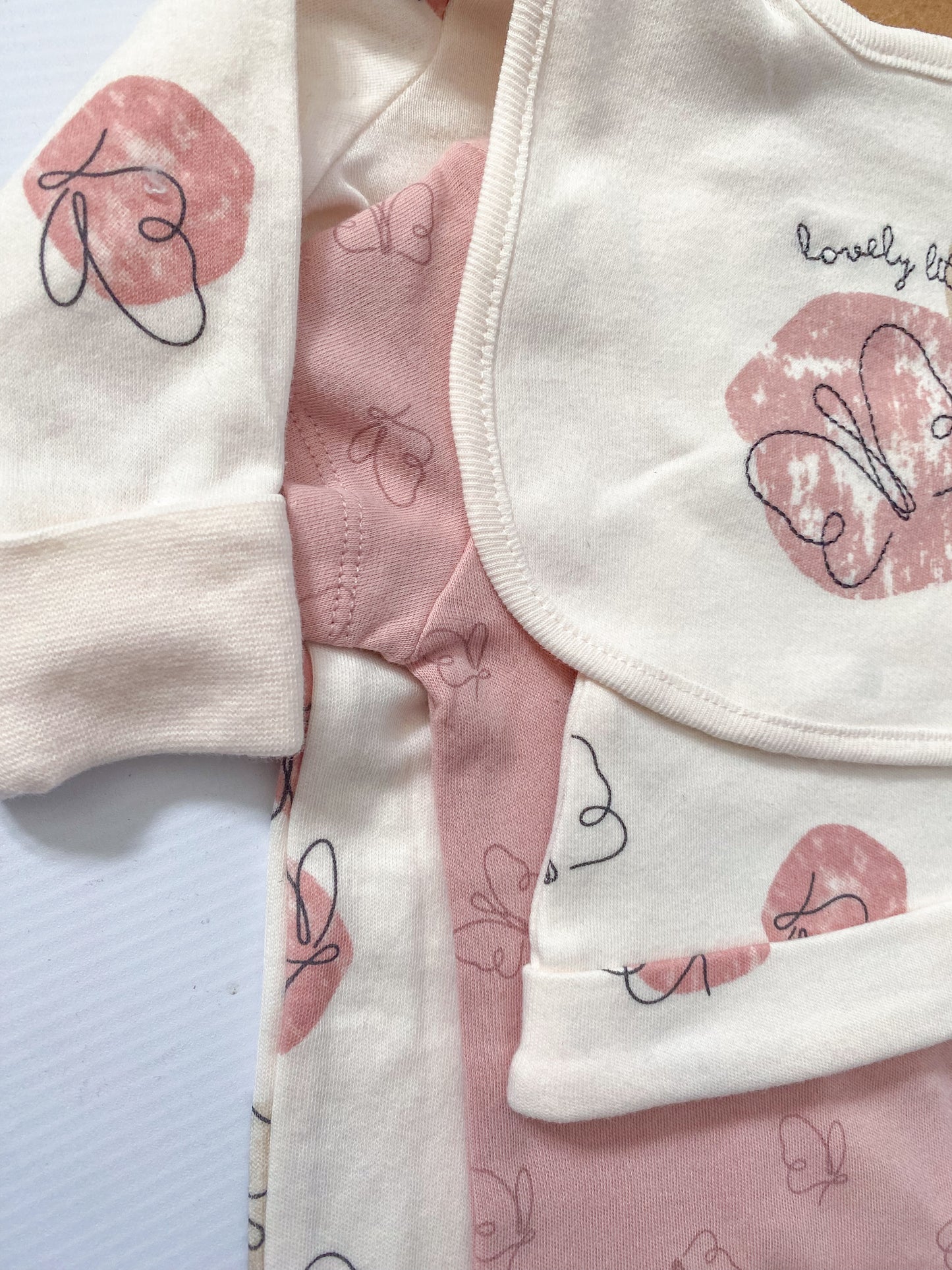 soft pink and cream baby outfit gift set with butterfly pattern print