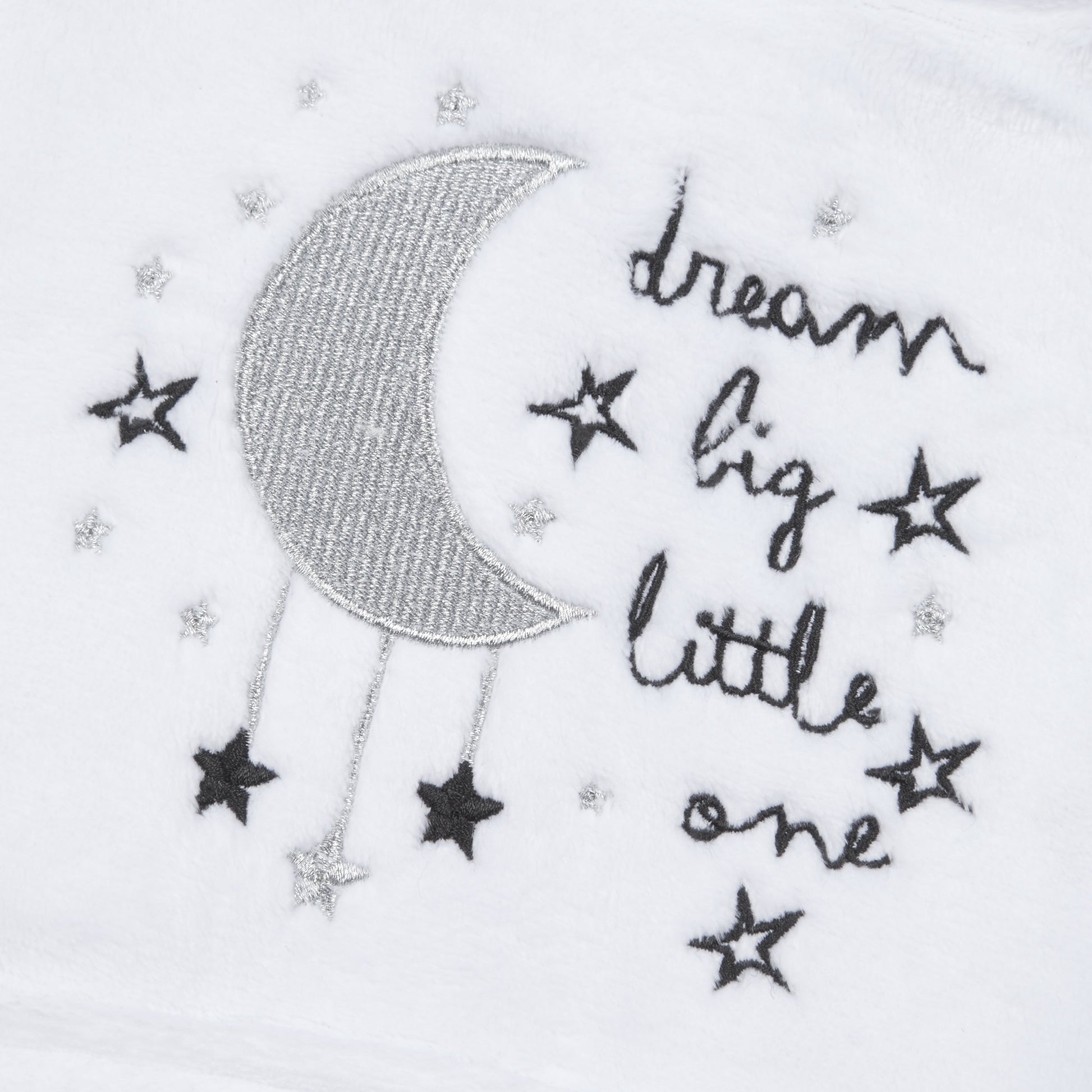 Embroidered moon with stars and text ‘dream big little one’.